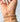 A close-up of a hand wearing sterling silver beaded bracelet