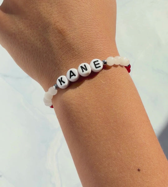 Video of children's crystal bracelet and 'KANE' letter beads