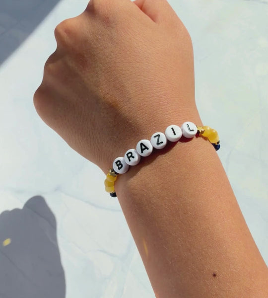 Brazil football bracelet worn by a child
